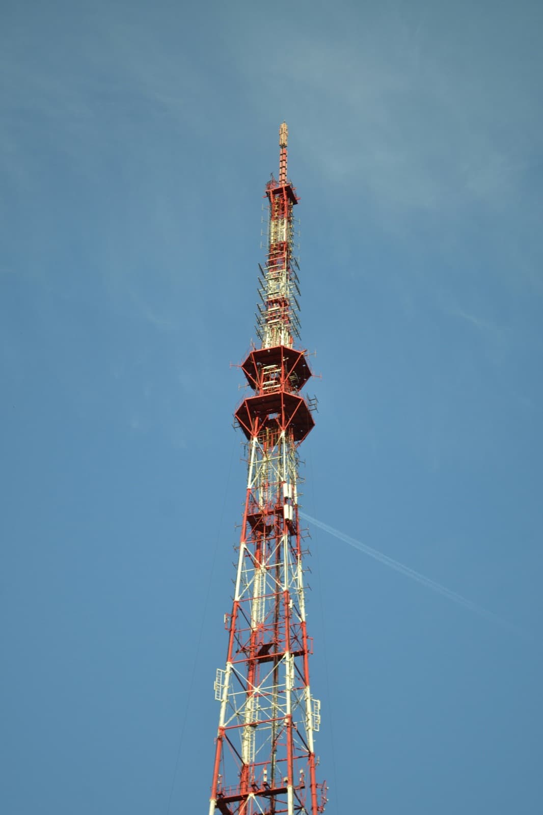A steel lattice mast rising against the sky